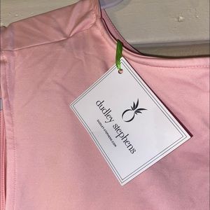 Im selling a never worn Dudley Stephen’s 2 piece bottoms and shirt. XL , pink.
